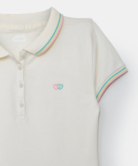 Camiseta tipo polo para niña en algodón color marfil