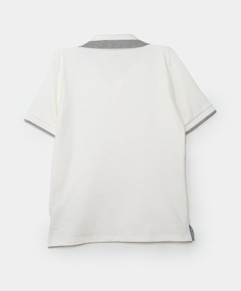 Camiseta tipo polo para niño en algodón color marfil