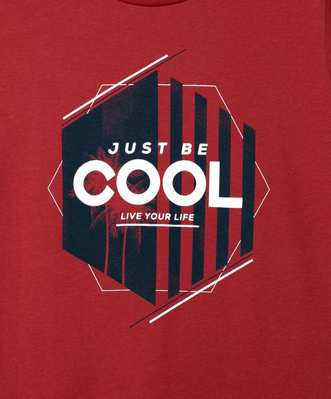 Camiseta manga corta para niño en tela suave color vino