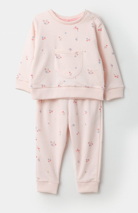 Conjunto de buzo y jogger para recién nacida en burda color rosado claro con estampado de flores