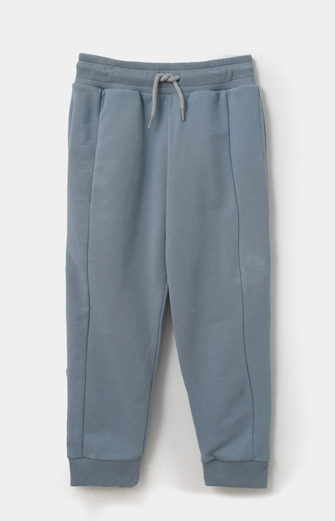 Conjunto de camiseta y pantalón para bebé niño en tela suave color marfil y azul medio