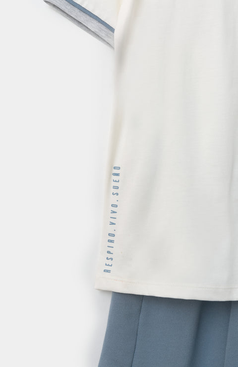 Conjunto de camiseta y pantalón para bebé niño en tela suave color marfil y azul medio