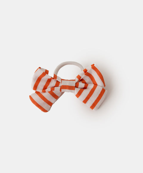 Moña para niña en tela suave color naranja con rayas blancas