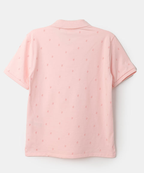 Camiseta tipo polo para niño en algodón color rosado claro