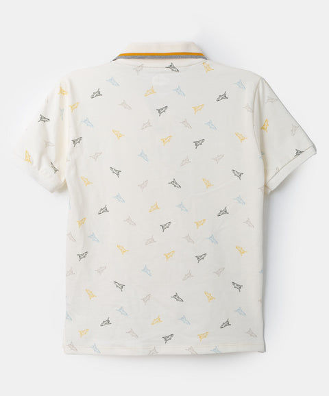 Camiseta tipo polo para niño en algodón color marfil