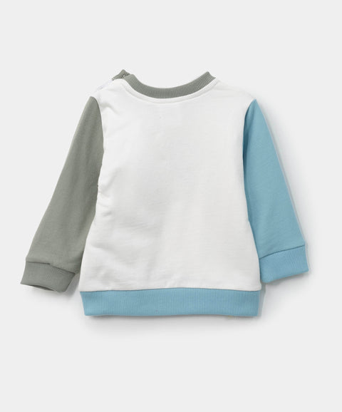 Buzo para recién nacido en burda color marfil con verde y azul